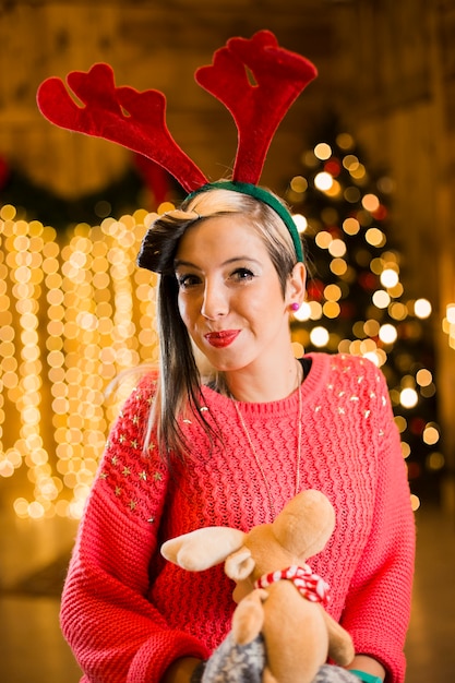 Christmas concept with happy woman with toy