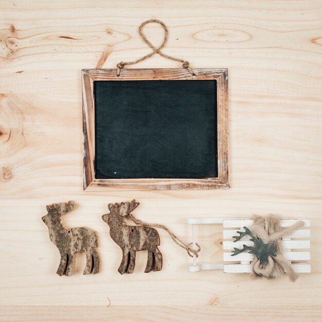 Christmas concept with slate and reindeers