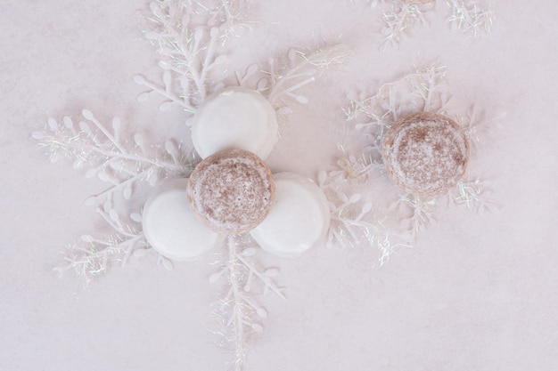 Free photo christmas cookies with snowflakes on white surface