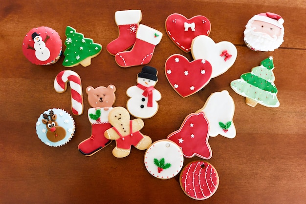 Free photo christmas cookies on wooden background