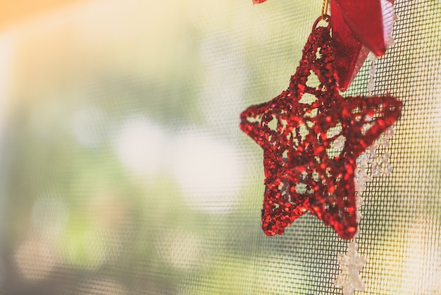 Free photo christmas decoration hanging in the window