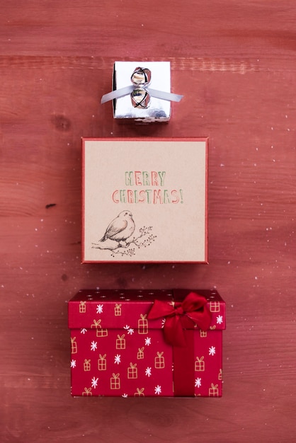 Free photo christmas decoration with three gift boxes