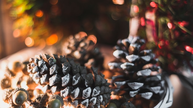 Free Photo christmas decoration with three pine cones