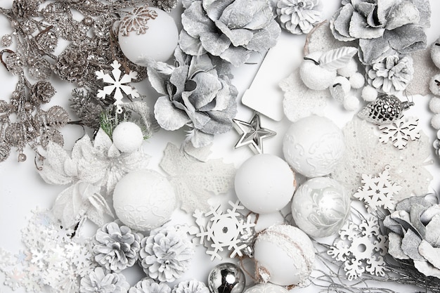 Christmas decorative composition of toys on a white table background.