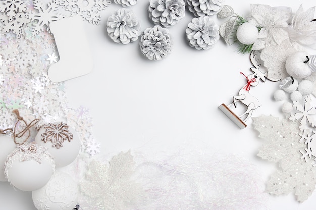 Christmas decorative composition of toys on a white table background.