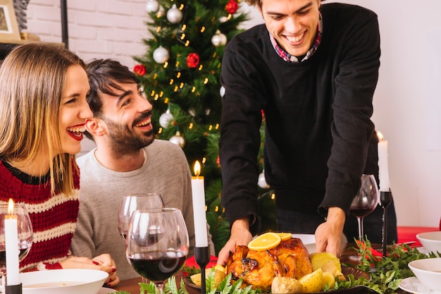 Christmas dinner with turkey and happy friends