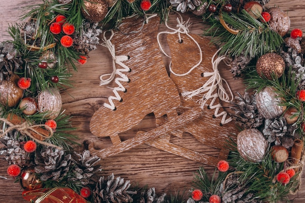 Free photo christmas flat lay on wooden background