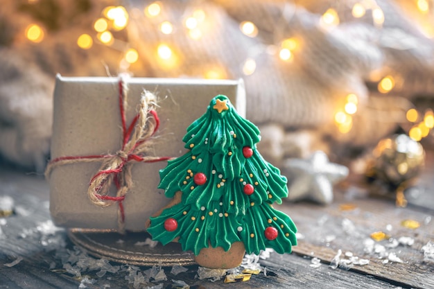 Christmas gift box and gingerbread on a blurred background