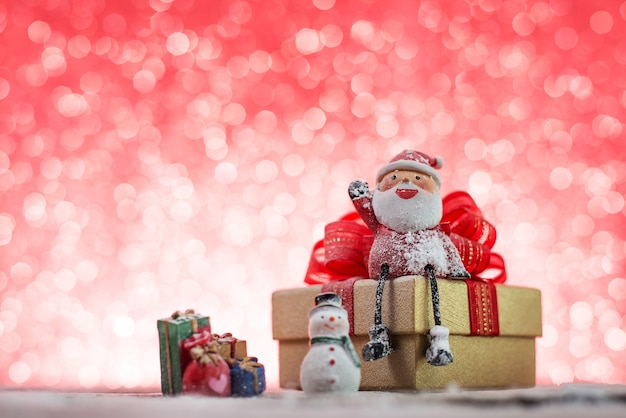 Free Photo christmas gift with santa claus and a snowman