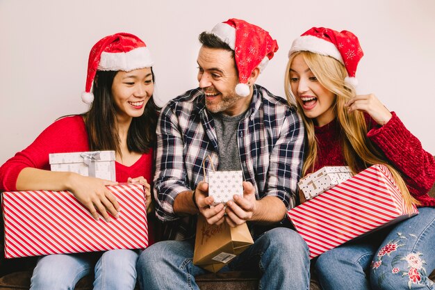 Christmas gifting concept with joyful friends