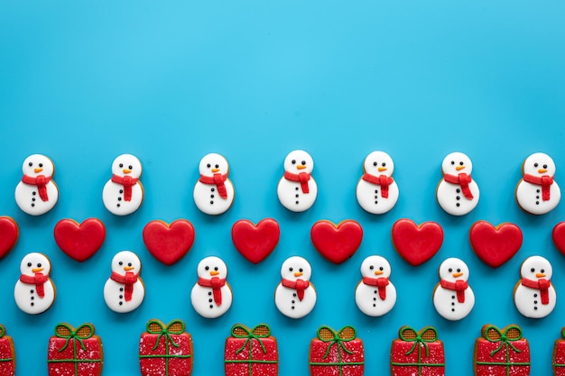 Free photo christmas gingerbread on a blue background flat lay