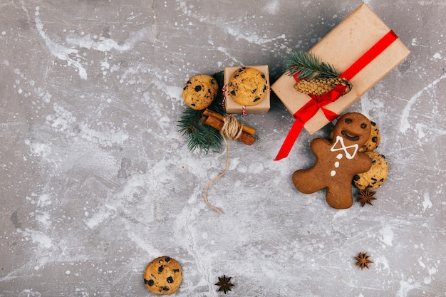 Free photo christmas gingerbreads and cookies lie before a present box