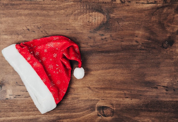 Christmas hat on wooden surface