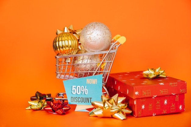 Christmas shopping concept with christmas balls in cart