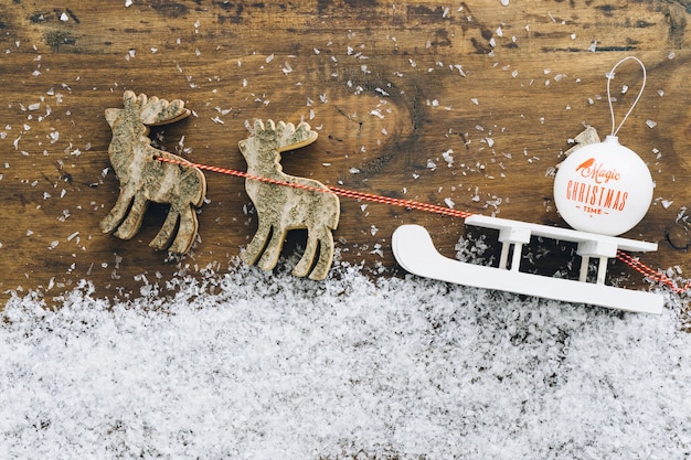 Free Photo christmas snow decoration with white sled