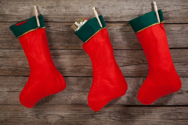 Free photo christmas socks hanging from a rope