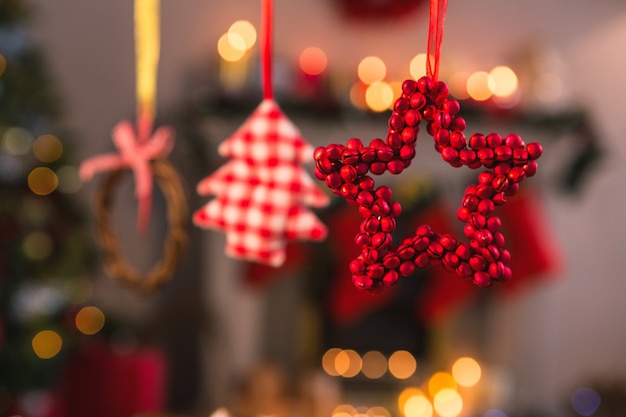 Christmas star and tree hanging on a rope