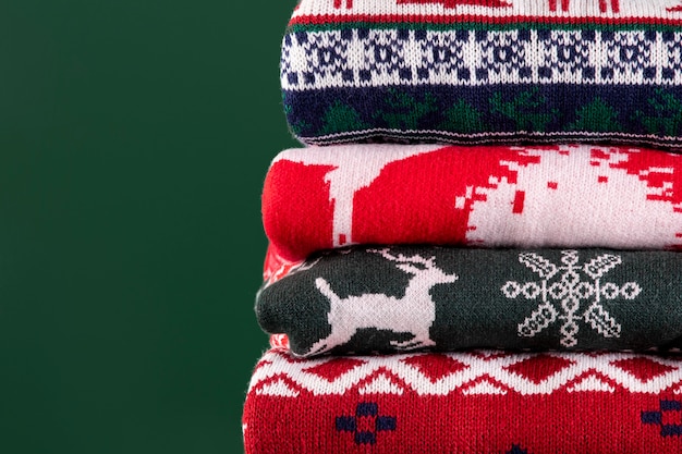 Christmas sweaters assortment  with green background