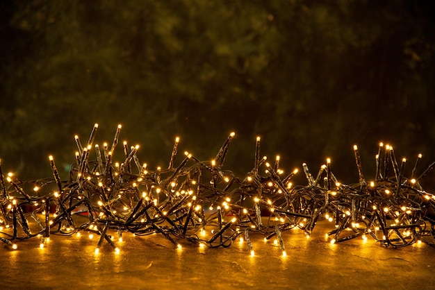 Free Photo christmas texture yellow lights festive on dark background