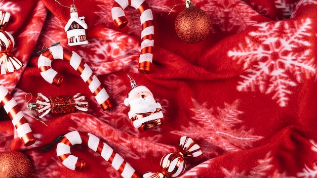 Free photo christmas toys with candy canes on blanket