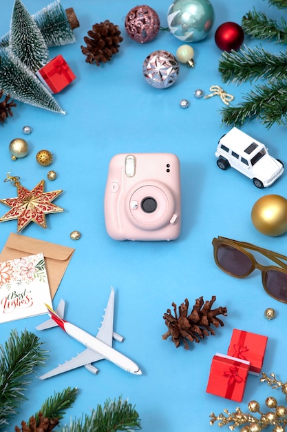 Free Photo christmas travel concept with polaroid