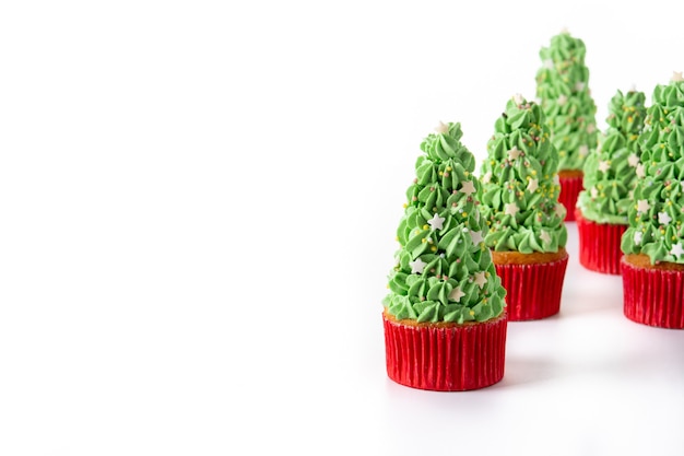 Christmas tree cupcakes isolated on white background