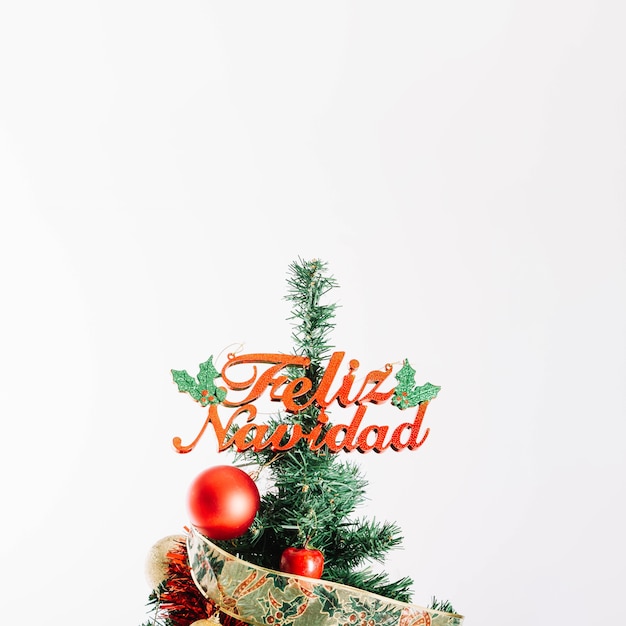 Free Photo christmas tree with feliz navidad letters