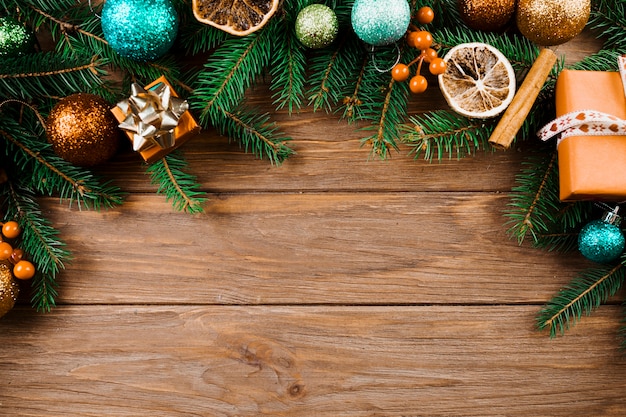 Christmas twig with ornament balls and present boxes