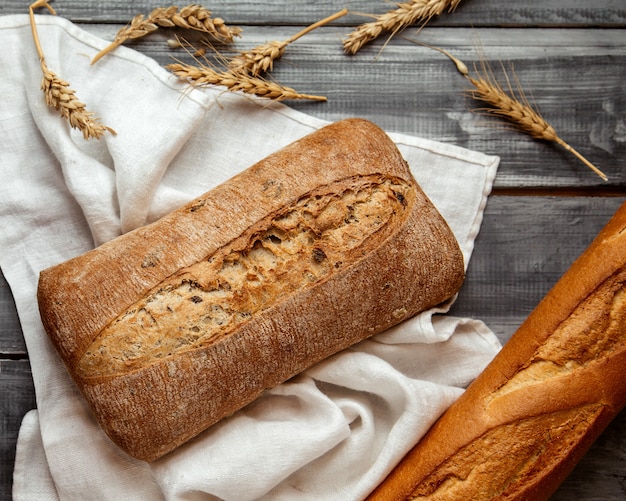 ciabatta bread with wheat on table