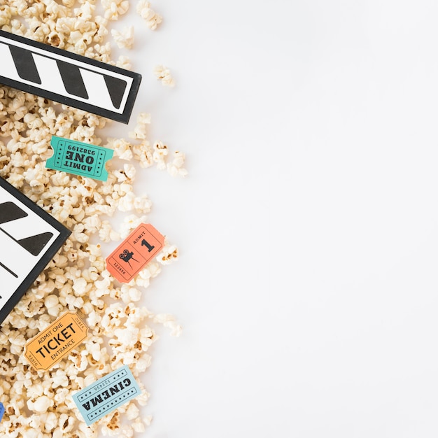 Cinema concept with clapperboard and popcorn