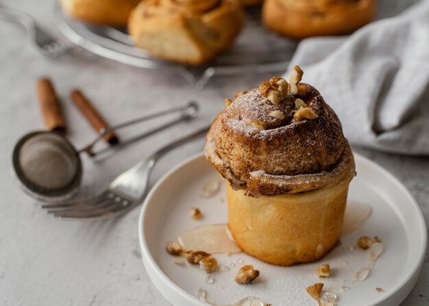 Cinnamon roll with nuts high angle