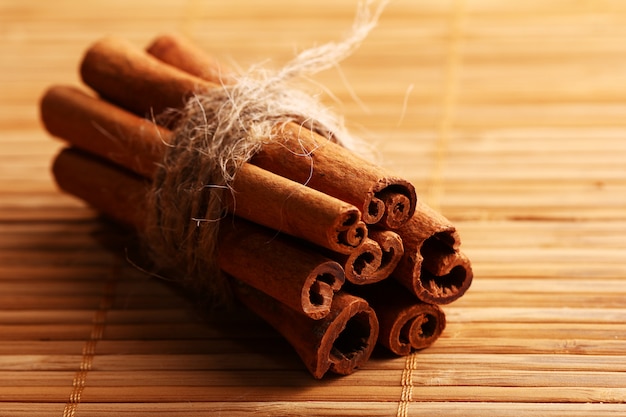 Cinnamon sticks on wooden rug