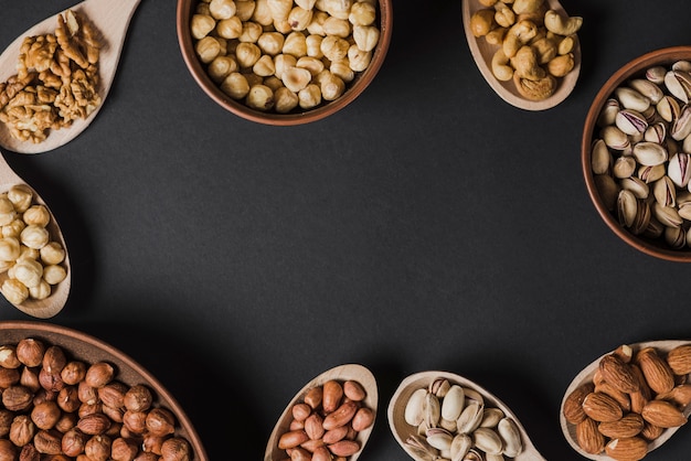 Circle from bowls and spoons with nuts