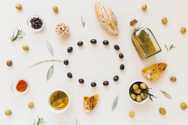 Free Photo circle of olives with bread spices and oil