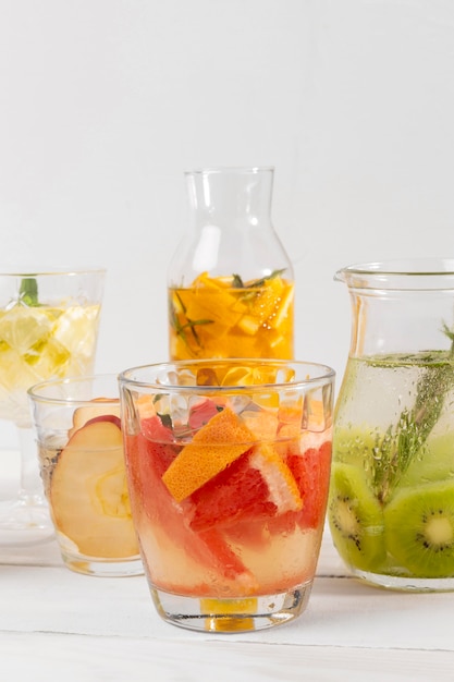 Citrus fruit drinks on table