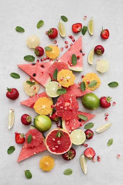 Citrus fruits, berries, watermelon and leaves