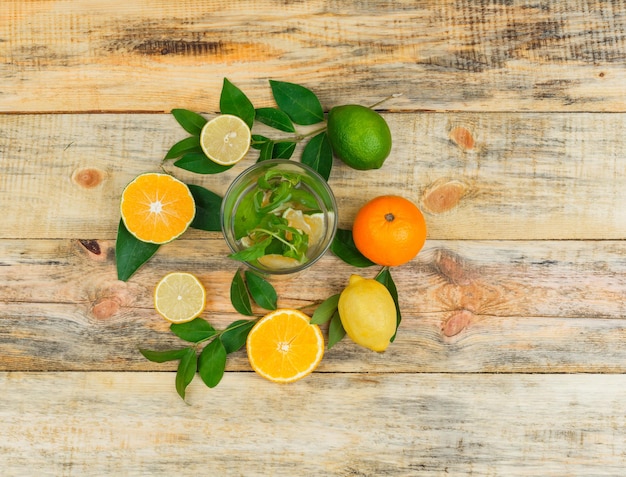 Free Photo citrus fruits with leaves with detox water