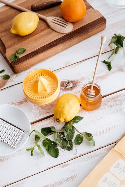 Citruses on table near honey