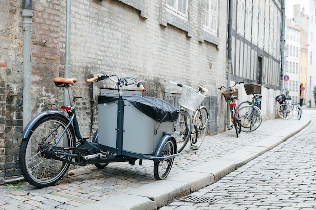 Free Photo city cobbled sidewalk with bicycles