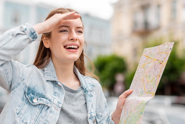 Free Photo city traveller holding a map