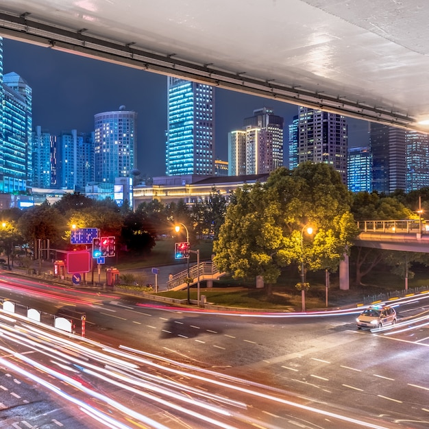 City view at night with traffic and trail light.