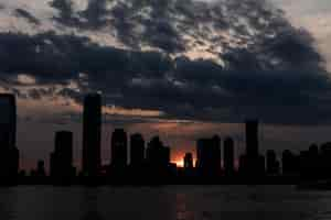 Free photo cityscape with big buildings and water