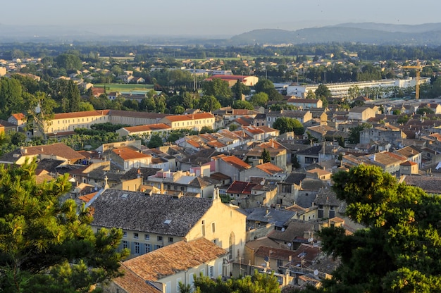 Free Photo a cityscape with a lot of buildings in france in the summer dawn at the park colline saint europe