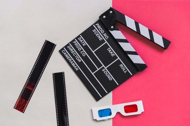 Clapboard near carton 3d glasses