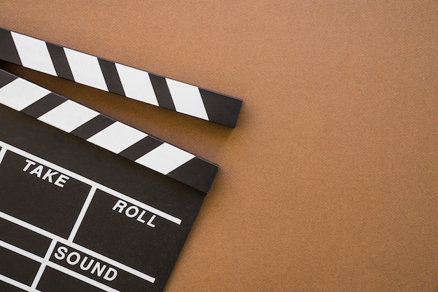 Free photo clapperboard on brown background