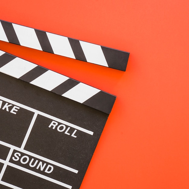 Free photo clapperboard on red background