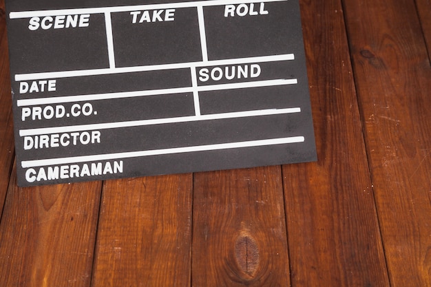 Clapperboard on wooden tabletop