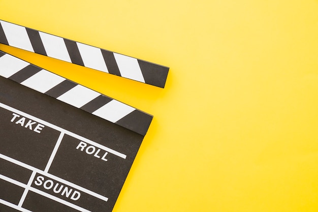 Clapperboard on yellow background