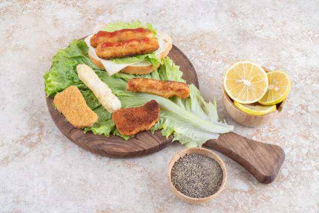 Classic grilled sausage sandwich with lettuce and lemons.