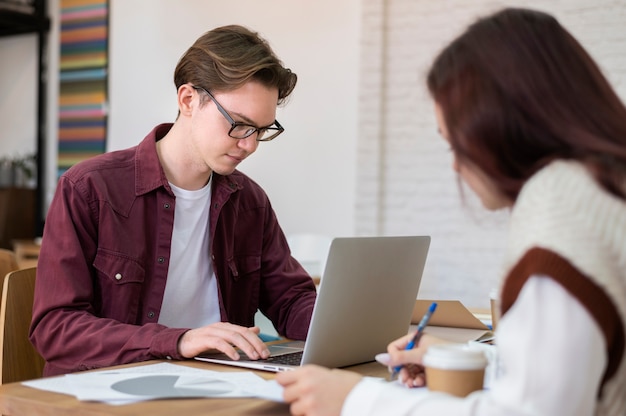 Classmates learning together in group study session